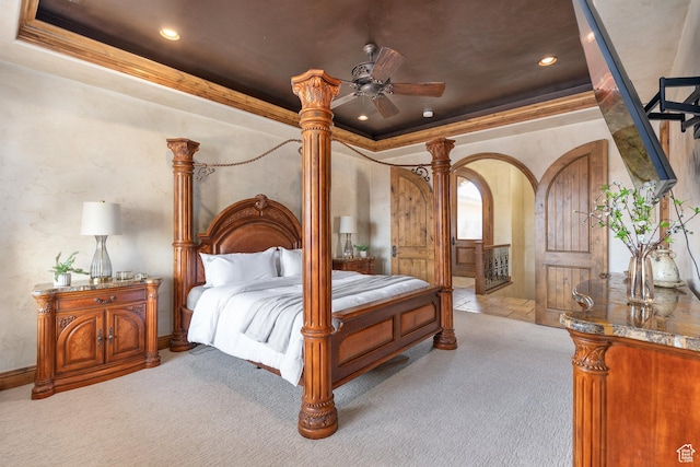 480 W Tonapah Way, Ivins, UT 84738 - bedroom with carpet flooring, a tray ceiling, recessed lighting, crown molding, and arched walkways