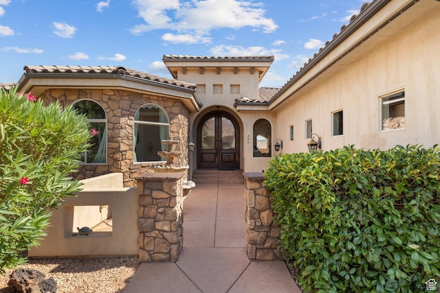 480 W Tonapah Way, Ivins, UT 84738 - property entrance with a tiled roof, stucco siding, and french doors