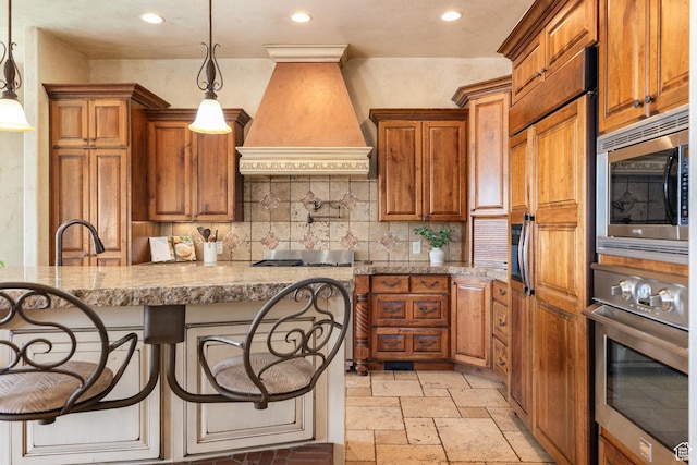 480 W Tonapah Way, Ivins, UT 84738 - kitchen with premium range hood, built in appliances, brown cabinets, recessed lighting, and stone tile flooring