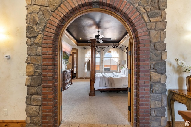 480 W Tonapah Way, Ivins, UT 84738 - unfurnished bedroom with arched walkways, carpet floors, a tray ceiling, and crown molding