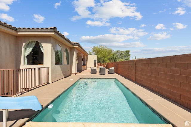 480 W Tonapah Way, Ivins, UT 84738 - view of swimming pool with an outdoor living space, a fenced backyard, and a patio