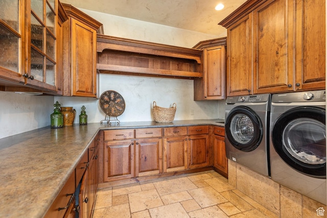 480 W Tonapah Way, Ivins, UT 84738 - laundry area with cabinet space, washing machine and dryer, and stone tile flooring