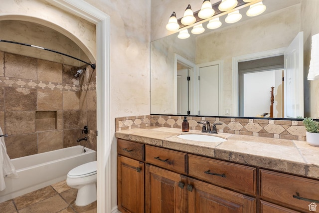 480 W Tonapah Way, Ivins, UT 84738 - bathroom featuring vanity, washtub / shower combination, and tasteful backsplash