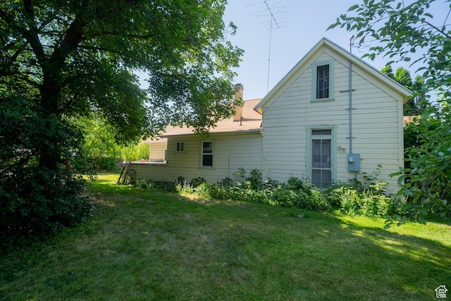 742 N 300 E, Logan, UT 84321 - back of property featuring a lawn and a chimney