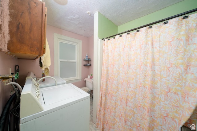 742 N 300 E, Logan, UT 84321 - laundry area featuring washer and dryer and a textured ceiling