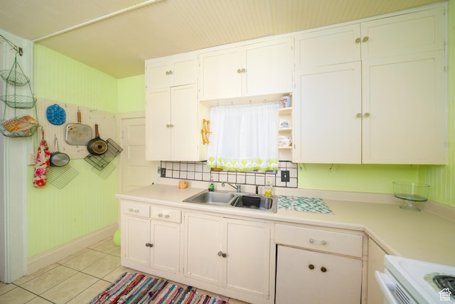 742 N 300 E, Logan, UT 84321 - kitchen with light countertops, light tile patterned floors, range, white cabinetry, and open shelves