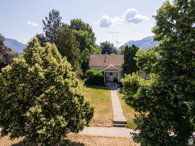 742 N 300 E, Logan, UT 84321 - view of front of home with a mountain view and a front yard