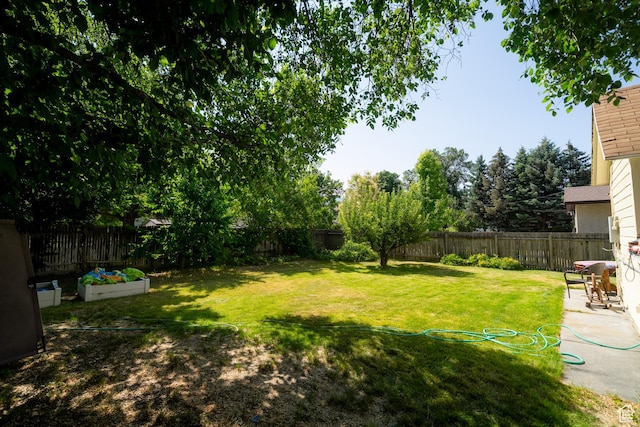 742 N 300 E, Logan, UT 84321 - fenced backyard with a vegetable garden