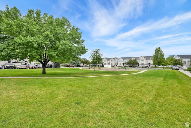 2221 W Davenshire Ln, Taylorsville, UT 84129 - view of community featuring a lawn and a residential view