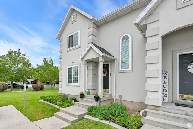 2221 W Davenshire Ln, Taylorsville, UT 84129 - view of property with a front yard and stucco siding
