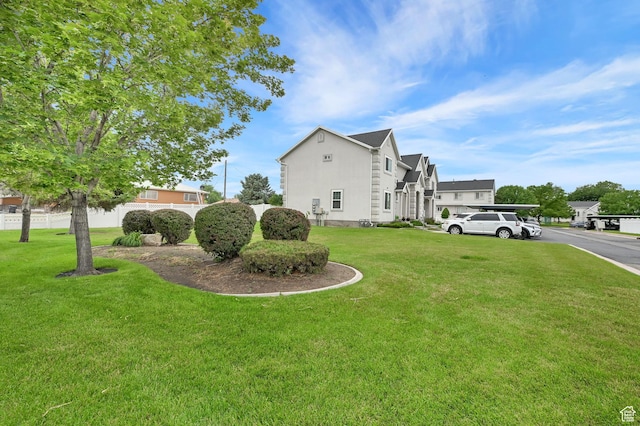 2221 W Davenshire Ln, Taylorsville, UT 84129 - view of home's exterior featuring a yard