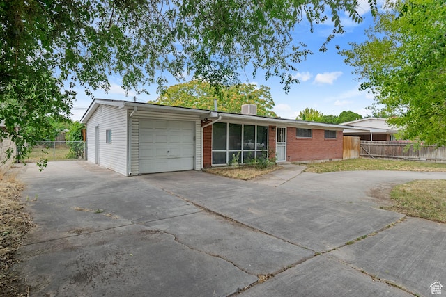 3310 S 3200 W, West Valley City, UT 84119 - ranch-style home with driveway, a garage, brick siding, and a chimney