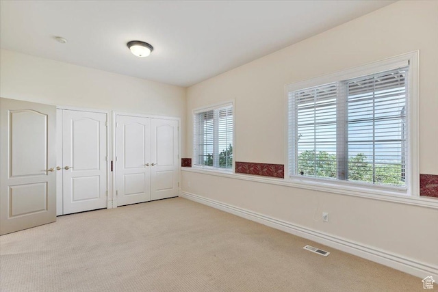 3356 Twin Peaks Cir, Layton, UT 84040 - unfurnished bedroom featuring two closets and carpet