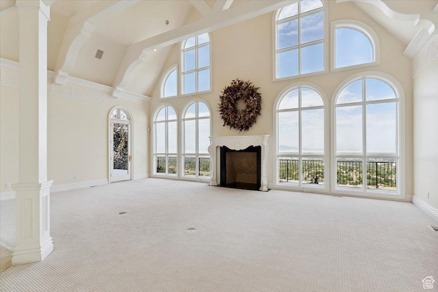 3356 Twin Peaks Cir, Layton, UT 84040 - unfurnished living room with high vaulted ceiling, carpet floors, healthy amount of natural light, a fireplace with flush hearth, and ornate columns