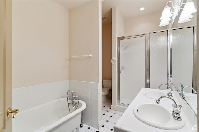 3356 Twin Peaks Cir, Layton, UT 84040 - bathroom with a soaking tub, a shower stall, a chandelier, double vanity, and tile patterned floors