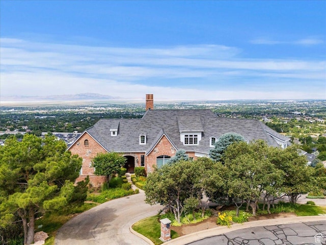 3356 Twin Peaks Cir, Layton, UT 84040 - view of front of house featuring brick siding and a chimney