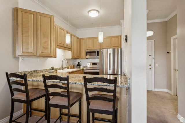 838 E S Temple S Unit 409, Salt Lake City, UT 84102 - kitchen featuring appliances with stainless steel finishes, light brown cabinets, light stone counters, a peninsula, and a breakfast bar