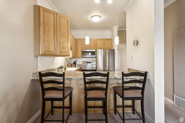 838 E S Temple S Unit 409, Salt Lake City, UT 84102 - kitchen featuring stainless steel appliances, a peninsula, crown molding, light brown cabinetry, and light stone countertops