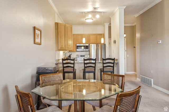 838 E S Temple S Unit 409, Salt Lake City, UT 84102 - dining space featuring light colored carpet, ornate columns, and crown molding