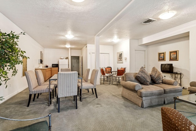 838 E S Temple S Unit 409, Salt Lake City, UT 84102 - carpeted dining room featuring a textured ceiling and baseboards