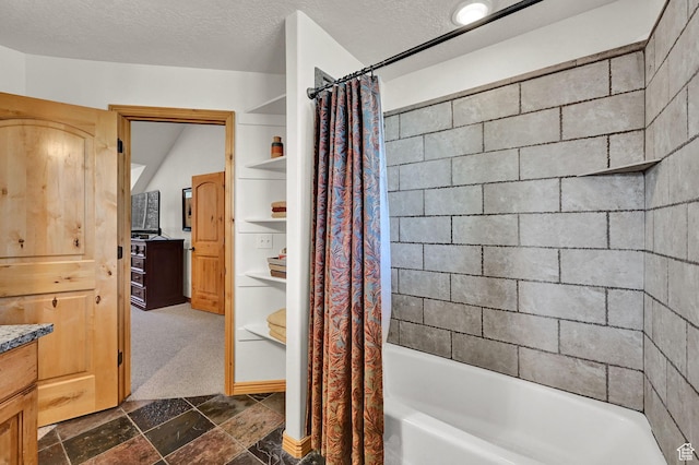 5060 E Lakeview Dr Unit 1109, Eden, UT 84310 - full bath featuring vanity, shower / bath combo with shower curtain, stone tile floors, and a textured ceiling