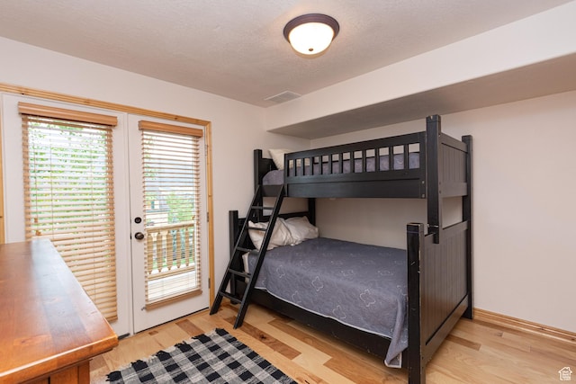 5060 E Lakeview Dr Unit 1109, Eden, UT 84310 - bedroom featuring wood finished floors and access to exterior