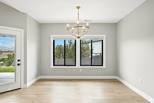 3127 W 2350 S, Cedar City, UT 84720 - unfurnished dining area with a chandelier and light wood-style flooring