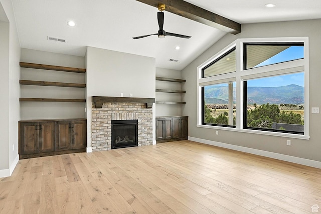 3127 W 2350 S, Cedar City, UT 84720 - unfurnished living room with light wood-style floors, a ceiling fan, a fireplace, and recessed lighting