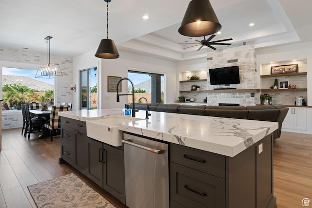 2616 S 3210 E, St George, UT 84790 - kitchen with stainless steel dishwasher, a raised ceiling, a ceiling fan, wood finished floors, and recessed lighting