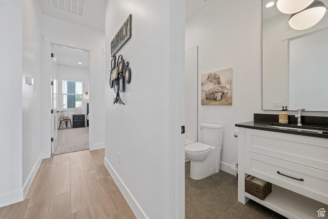 2616 S 3210 E, St George, UT 84790 - bathroom with vanity and wood finished floors