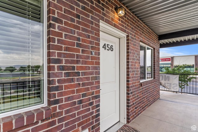 456 W Main N, Santaquin, UT 84655 - doorway to property featuring brick siding and covered porch