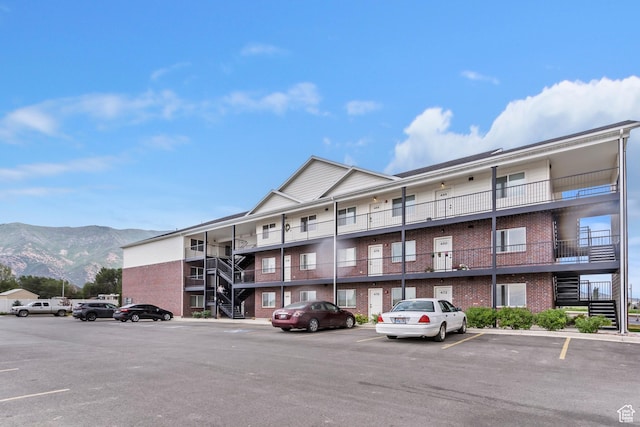 456 W Main N, Santaquin, UT 84655 - view of apartment building / complex featuring uncovered parking, a mountain view, and stairs