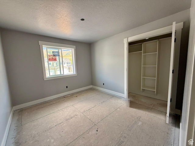 565 S 1140 E Unit 1203, Smithfield, UT 84335 - unfurnished bedroom featuring a textured ceiling and a closet