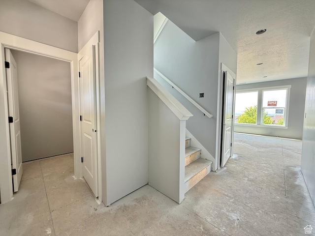 565 S 1140 E Unit 1203, Smithfield, UT 84335 - staircase featuring a textured ceiling