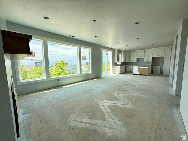 565 S 1140 E Unit 1203, Smithfield, UT 84335 - unfurnished living room featuring a textured ceiling