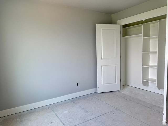 565 S 1140 E Unit 1203, Smithfield, UT 84335 - unfurnished bedroom featuring baseboards and a closet