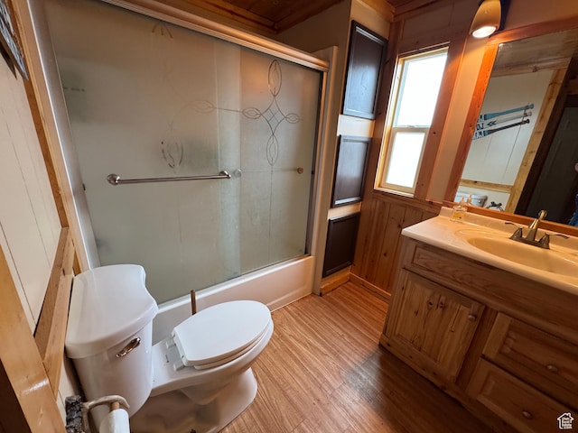 738 E Vanessa Ln Unit 386, Garden City, UT 84028 - full bathroom featuring vanity, wood finished floors, and bath / shower combo with glass door