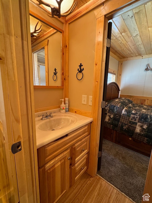 738 E Vanessa Ln Unit 386, Garden City, UT 84028 - bathroom with vanity, wooden ceiling, and wood finished floors