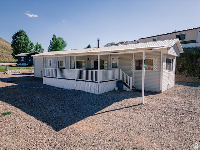 738 E Vanessa Ln Unit 386, Garden City, UT 84028 - view of front of property with covered porch, a metal roof, and crawl space