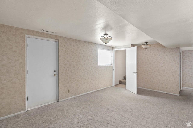 6871 S Alfalfa Cir, West Jordan, UT 84084 - carpeted empty room featuring a textured ceiling, wallpapered walls, and stairway