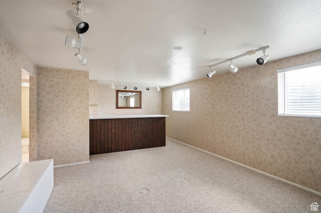 6871 S Alfalfa Cir, West Jordan, UT 84084 - basement featuring track lighting, wallpapered walls, and carpet