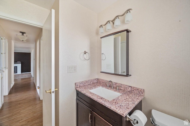 6871 S Alfalfa Cir, West Jordan, UT 84084 - bathroom featuring wood finished floors and vanity