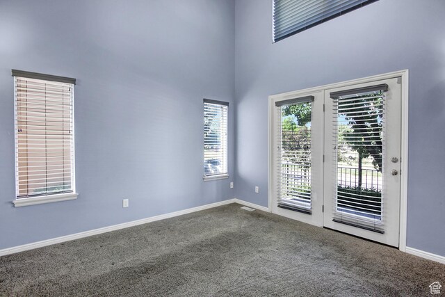 888 N Shepard Creek Pkwy W, Farmington, UT 84025 - spare room featuring carpet flooring and a towering ceiling