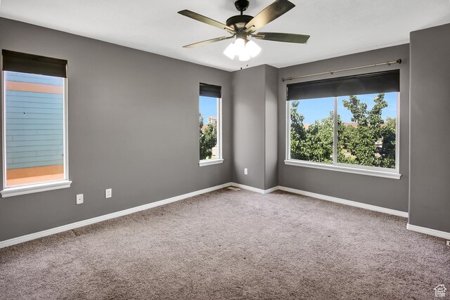 888 N Shepard Creek Pkwy W, Farmington, UT 84025 - empty room with healthy amount of natural light, carpet flooring, and ceiling fan