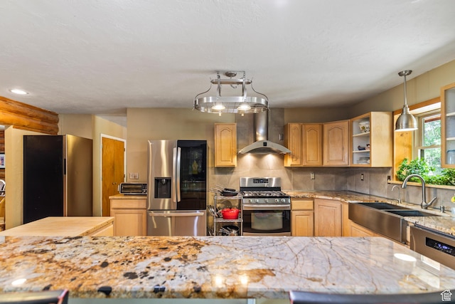 986 E 2290 N, Monroe, UT 84754 - kitchen featuring appliances with stainless steel finishes, wall chimney exhaust hood, light brown cabinetry, light stone countertops, and tasteful backsplash