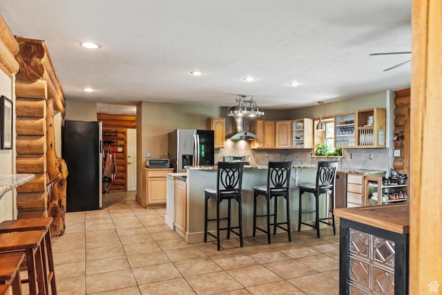 986 E 2290 N, Monroe, UT 84754 - kitchen with stainless steel appliances, rustic walls, light brown cabinets, open shelves, and light tile patterned floors