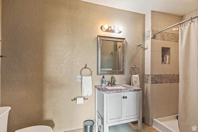 986 E 2290 N, Monroe, UT 84754 - bathroom with tiled shower, vanity, and a textured wall