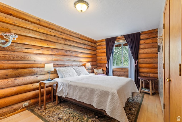 986 E 2290 N, Monroe, UT 84754 - bedroom featuring rustic walls and light wood-type flooring