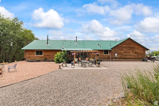 986 E 2290 N, Monroe, UT 84754 - back of house with a metal roof, a patio area, and log siding
