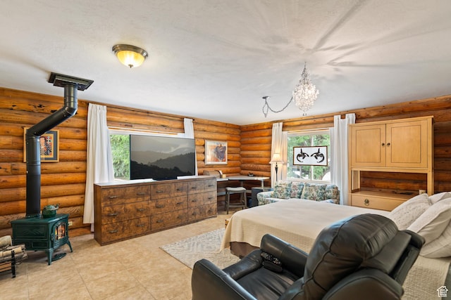 986 E 2290 N, Monroe, UT 84754 - living room with a wood stove, log walls, a chandelier, and light tile patterned floors